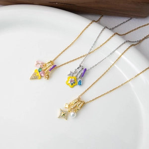 Detail of enamel flower, heart zircon and ice cream pendants on elegant chains