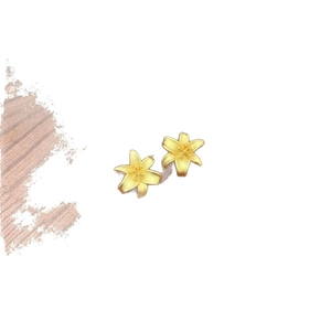 Matte gold lily flower stud earrings with a brushed metal texture on white background