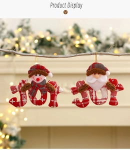 Detail of JOY fabric Christmas tree ornaments with snowman and Santa claus characters