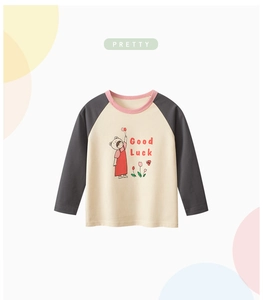 Detail of children's raglan sleeve T-shirt with Good Luck cartoon girl illustration