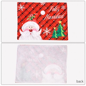 Front and back detail of Christmas placemat with Santa Claus and red plaid pattern