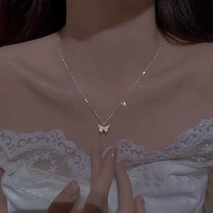 Elegant minimalist butterfly pendant necklace with pavé crystals on a silver chain