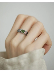 Detailed view of silver Hetian jade gourd ring with auspicious cloud carvings on hand