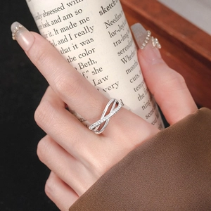 Three-layer crisscross silver ring with pavé zircons for an elegant minimalist look