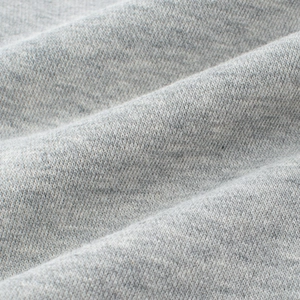 Close-up of premium grey marl knit fabric showing soft texture for children pants