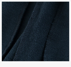 Detailed macro view of dark navy cotton french terry fabric and high-quality stitching
