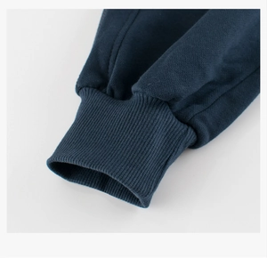 Detail of dark navy blue ribbed cuffs on children's cotton blend sports pants