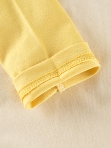 Lemon yellow long sleeve cotton t-shirt for girls featuring premium hem detailing