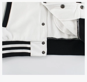 Detail of metal snap buttons and striped ribbed hem with soft warm fleece lining