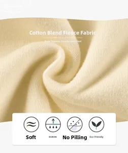 Vue macro du tissu polaire doux en coton mélangé beige montrant la texture du tricot