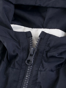 Navy blue hooded windbreaker jacket with white lining and premium zipper detail