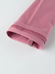 Detailed view of pink long sleeve cotton shirt cuff with premium double stitching