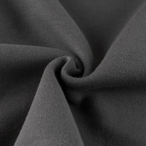 Macro detail of high-quality dark grey fleece fabric for kids' winter baseball jackets
