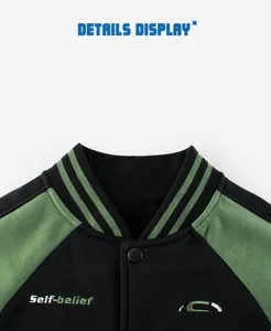 Detail view of striped ribbed collar and self-belief embroidery on kids baseball jacket