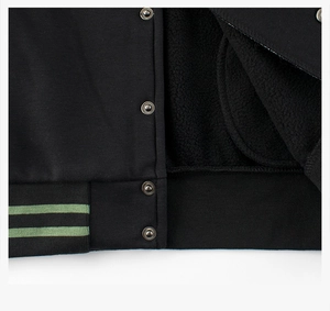 Detail of children jacket showing warm fleece lining and striped ribbed hem with snaps
