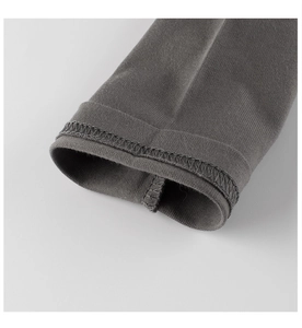 Detail of dark grey knit cuff with professional double-needle stitching on long sleeve tee