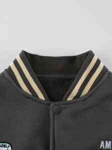 Deep grey varsity jacket featuring striped rib collar and cozy fleece lining