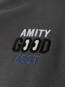 Detailed embroidery of AMITY GOOD ZEST on kids charcoal grey baseball jacket