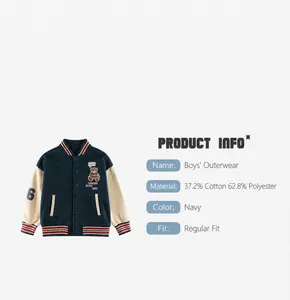Detail of blue kids baseball jacket featuring bear embroidery and cotton blend fabric