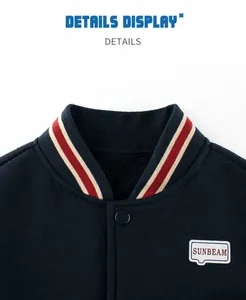 Detail of ribbed collar and snap buttons on fleece-lined navy baseball jacket for kids