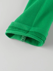 Green long sleeve kids T-shirt featuring high-density ribbed knit cuffs and fine stitching