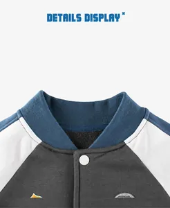 Close-up of ribbed baseball collar and fleece lining on color-block kids jacket