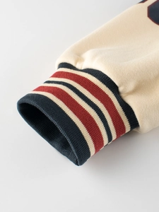 Kids vintage baseball jacket featuring navy and red striped ribbed cuffs with soft knit fabric