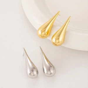 Polished gold and silver teardrop earrings with a smooth reflective mirror finish