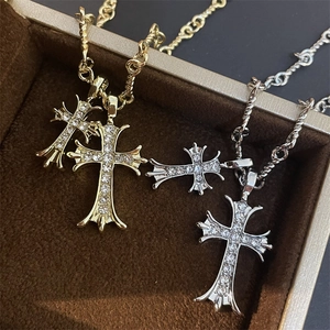 Gothic cross pendant necklace set in gold and silver finish with baroque crystal details