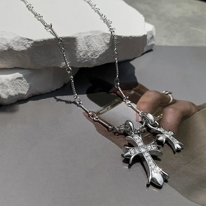 Baroque style silver cross pendant necklace with sparkling zircon crystals on mineral stone