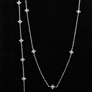 Elegant four-leaf flower necklace with sparkling zircon crystals on a fine silver chain