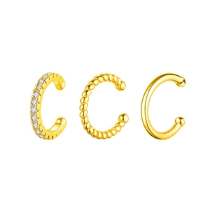 Three-piece gold ear cuff set with CZ stones, twisted texture, and polished finish