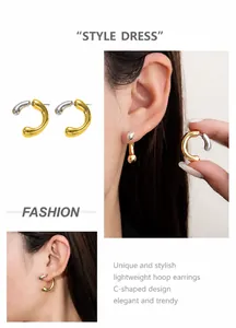 Detail of two-tone gold and silver C-shaped chunky earrings on model's ear