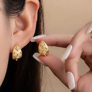 Golden teardrop stud earrings with brushed texture and star zircon inlay for women