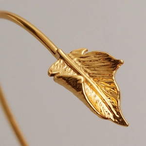 French retro gold wave leaf open cuff bracelet with detailed texture and metallic finish