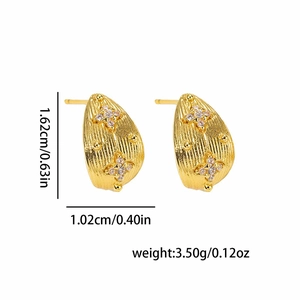 Minimalist gold C-shaped earrings with vertical stripes and zircon star accents