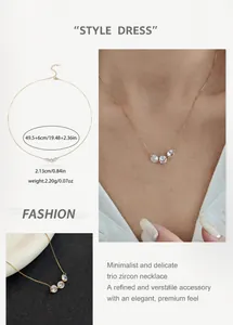 Detailed view of gold chain necklace with three micro-set zircon stones and size specs