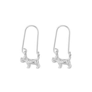 Symmetric pair of silver schnauzer dog drop earrings with U-shaped hooks on white background