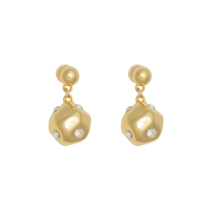 Detail of gold geometric drop earrings with sparkling crystal accents and polished finish
