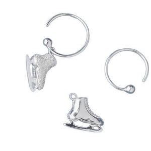 Detail of silver ice skate earrings with sparkling pave-set zircons on white background