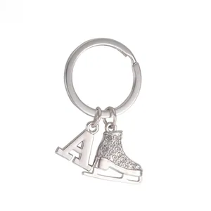 Detail of silver ice skate earring with sparkling rhinestones and an initial letter A