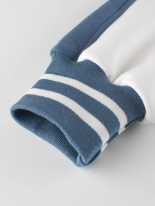 Kids baseball jacket with blue and white striped ribbed cuffs and soft fleece lining