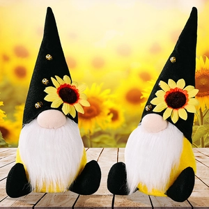 Detail of sunflower gnome pair with felt hats and bee accents on rustic wood background