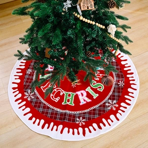 Christmas tree skirt with Merry Christmas text, red plaid edge and snowflake patterns