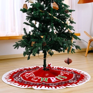 Red Christmas tree skirt with Merry Christmas text and white snowflake edges decoration
