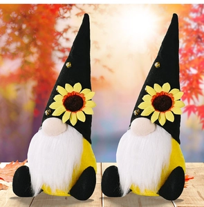 Detailed plush sunflower gnomes with black pointed hats and honey bee accents for autumn