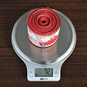 Close-up of patriotic truck printed ribbon weighing 72.1g on a scale for home decor