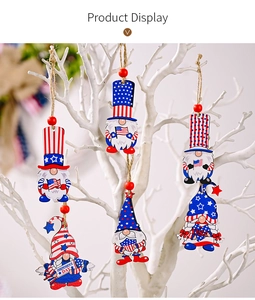 Detail of wooden gnome ornaments in red white and blue for Independence Day decor