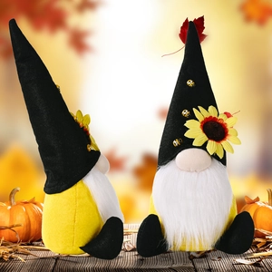 Harvest gnome set with sunflowers and bees on rustic wood with autumn pumpkins