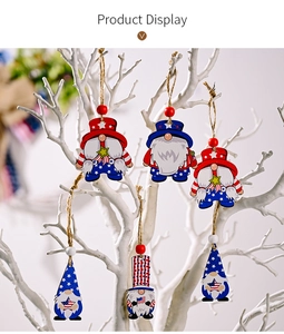 Independence Day gnomes ornaments with star and stripe patterns hanging on a white branch